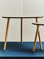 Set of 2 Natural Wooden Nesting Side Tables with Tripod Legs and Rounded Triangle Tops | Rostok
