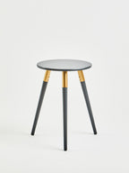 Dark Grey Round Top Wooden Side Table with Natural Wood Legs and Gold Trim | Nostra