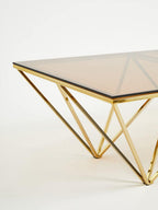 Red-Tinted Tempered Glass Top Coffee Table with Geometric Prismatic Champagne Metal Legs, Allure