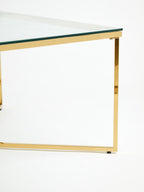 Gold Finish Coffee Table with Intersecting Cross Base and Clear Glass Top, Allure